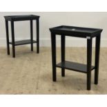 A pair of contemporary stained hardwood end tables, the tray top raised on square tapered supports