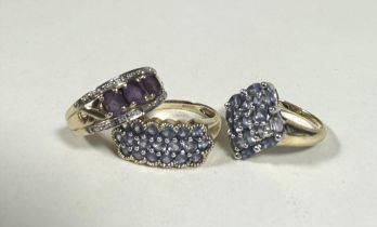 A 9ct gold QVC navette shaped lavender coloured stone cluster ring, M, a 9ct gold QVC triple row