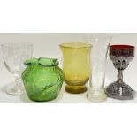 A mixed lot of glass comprising a Victorian clear glass goblet, a Loetz style Art Nouveau green