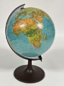 A modern illuminated students terrestrial globe on stand, ( H x 36cm x D x 23cm )