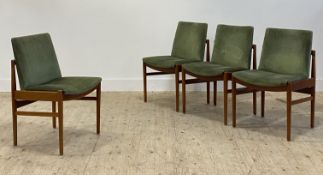 A set of four mid century teak framed dining chairs, with green velvet upholstered seat and back,