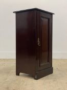 An Edwardian mahogany bedside cupboard, the panelled door enclosing a plain interior H76cm, W39cm,