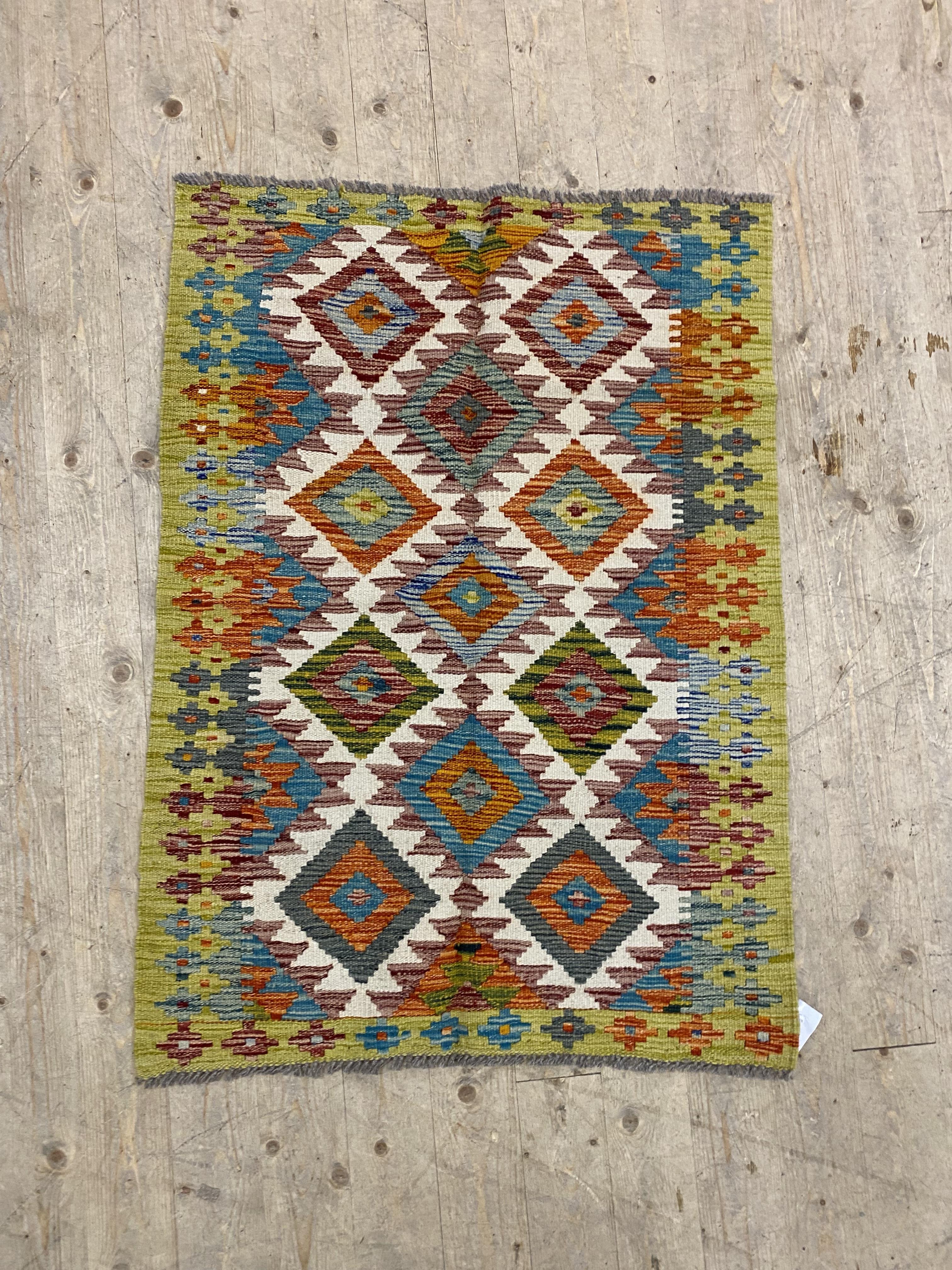 A Chobi kilim rug of overall geometric design 118cm x 87cm