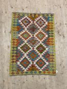 A Chobi kilim rug of overall geometric design 118cm x 87cm