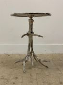 A cast aluminium occasional table, the circular top raised on supports formed as antlers. H53cm