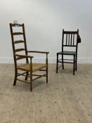 A country stained beech ladder back chair, with rush seat, raised on turned supports (H102cm)