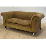 A Victorian style Chesterfield two seat sofa, upholstered in traditional chenille fabric, raised
