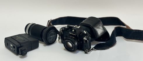A Nikon EM camera with a Lens series E 50mm 1:1.8 lens and case, a Hoya HMC Zoom 70-150mm lens and a