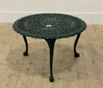 A green painted cast aluminium low table with floral decoration, raised on three cabriole supports