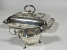 A Asprey of London Silver George III style sauce boat with scalloped rim and C scroll handle