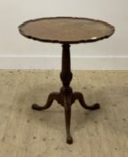 A George III mahogany snap top occasional table, the circular pie crust top raised on turned and