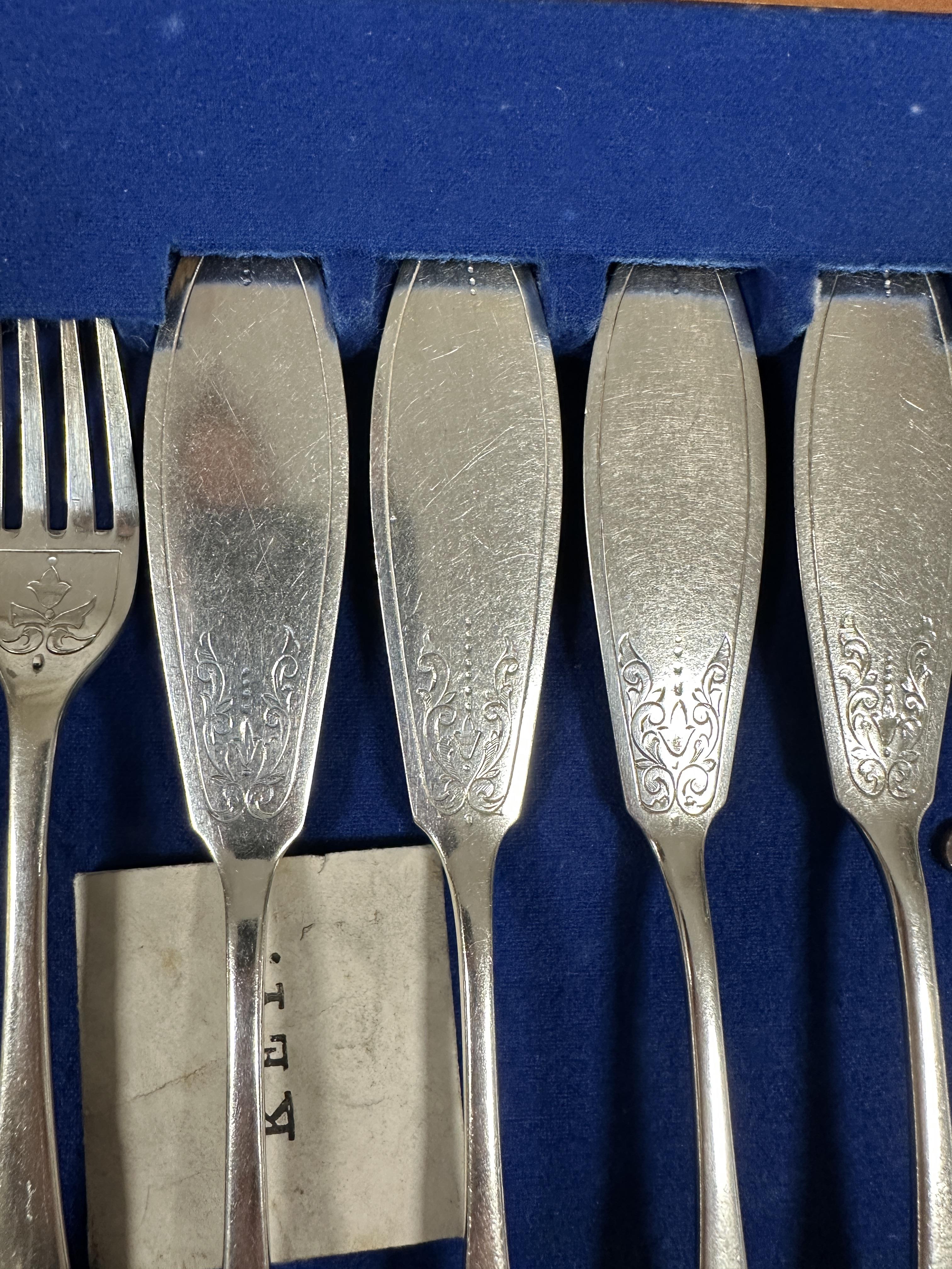 A Edwardian mahogany canteen containing twelve pairs of engraved Epns fish knives and forks in based - Image 2 of 3