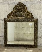 An early 20th century hammered brass framed wall hanging mirror with bevelled plate 62cm x 46cm