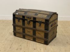 A 19th century pony skin covered and metal bound dome top seamer trunk with leather carry handle