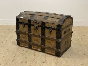 A 19th century pony skin covered and metal bound dome top seamer trunk with leather carry handle