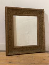 An early 20th century oak leaf and acanthus moulded gilt composition framed wall hanging mirror 58cm