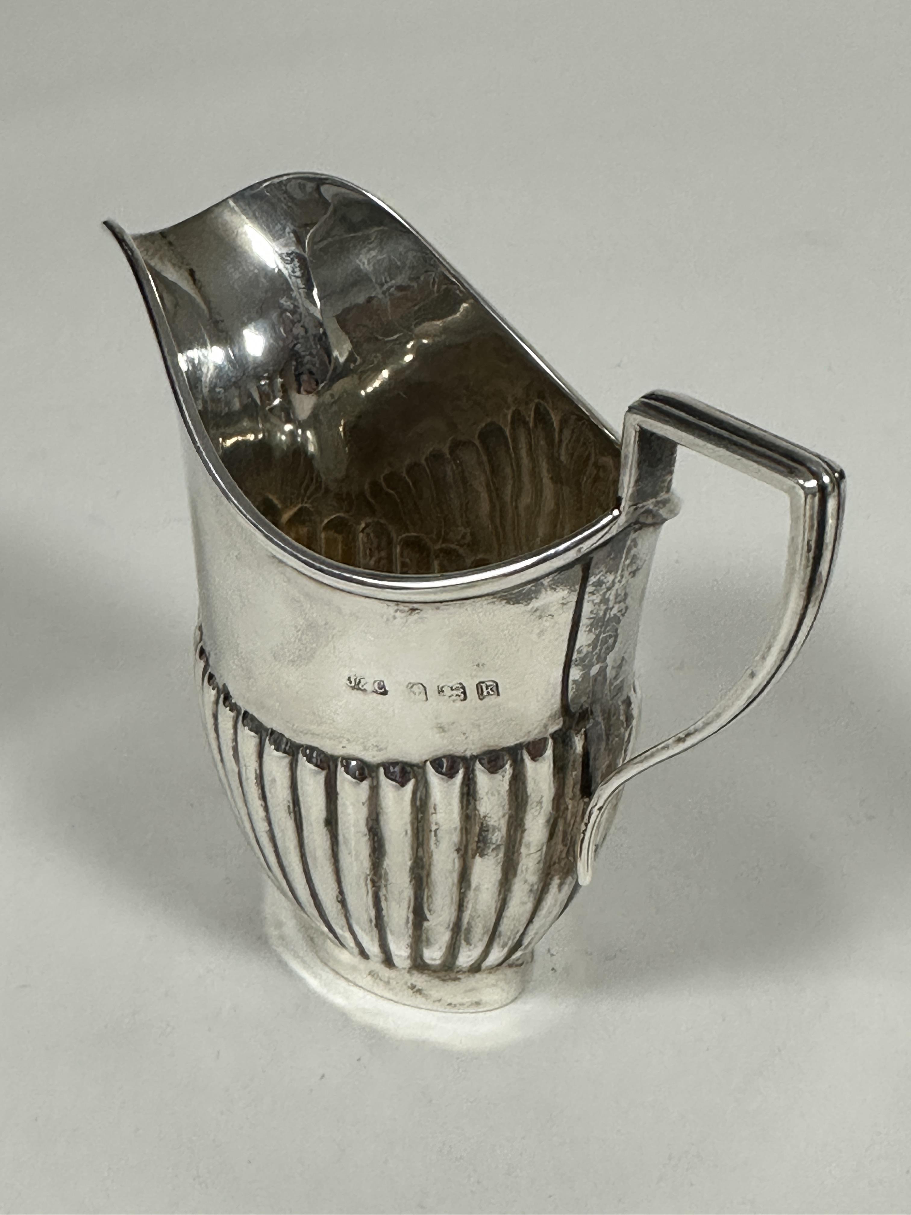 A Edwardian Birmingham silver half lobbed helmet shaped cream ewer, (H x 8.5cm x L x 9cm, Birmingham - Image 2 of 2