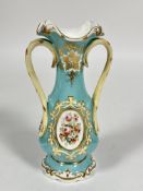 A 19thc Porcelain two handled panelled baluster vase the oval panel with enamel roses, poppies,