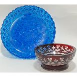 A blue pressed glass dish with geometric design (w- 28cm), together with a flashed ruby glass bowl