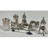 A Birmingham five piece condiment set comprising, a pair of oval salt sellers, a pair of pepperettes