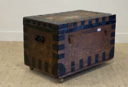 A 19th century metal bound pine travelling trunk, the lid, opening to reveal a tin lined interior