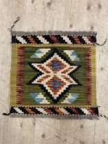 A Chobi kilim mat with star medallion and bordered 46cm x 50cm