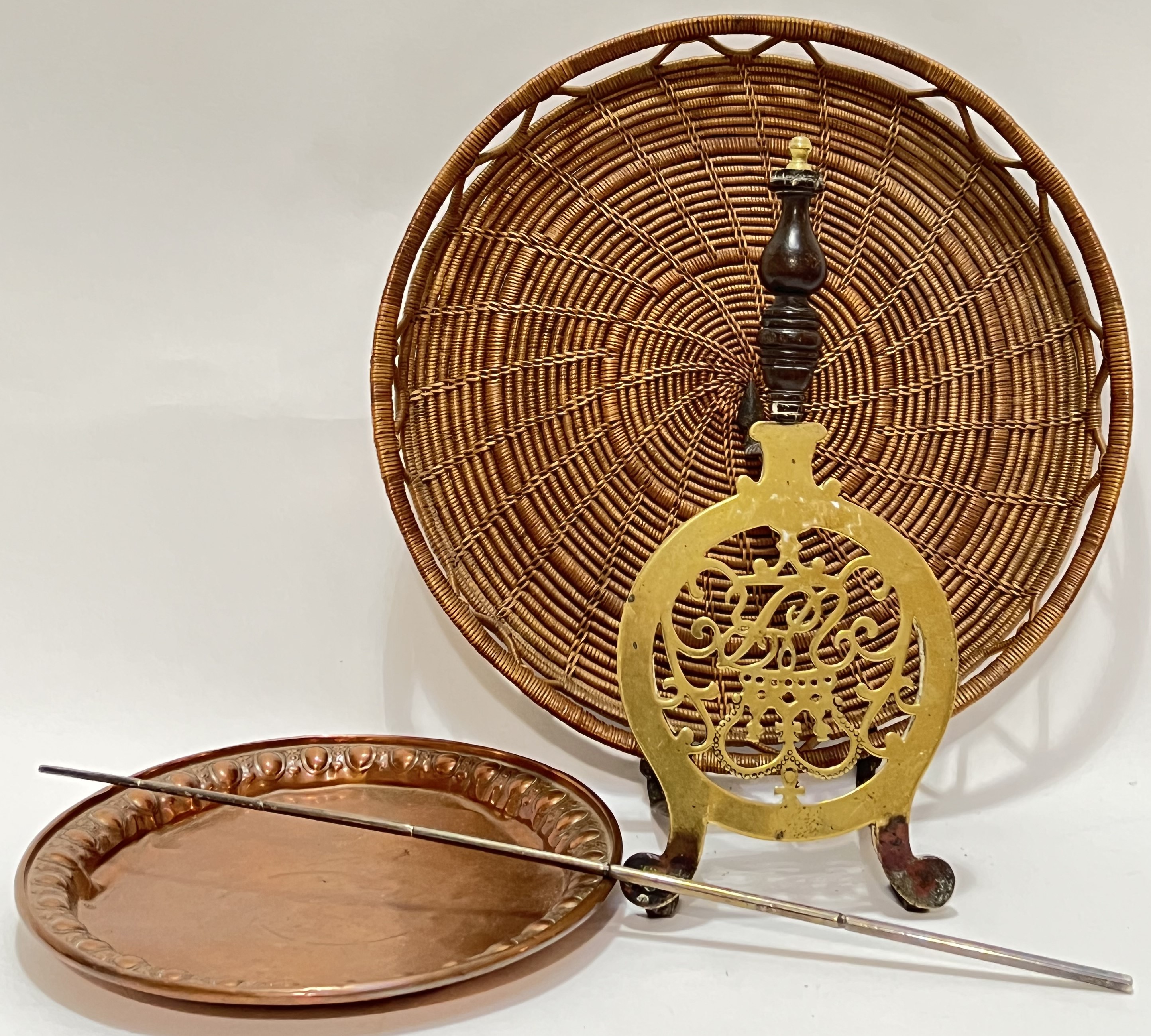 A mixed lot comprising a circular woven tray (w- 37cm), a copper tray with egg and dart border, a