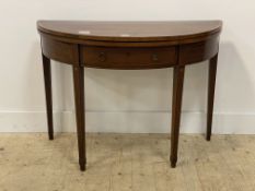 A George III mahogany demi-lune fold over tea table, circa 1800, the top with satinwood cross