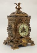 A French gilt brass mantel clock in the baroque taste, circa 1900, the elaborately floral cast