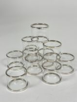 A set of ten glass white metal mounted napkin rings, (H x 3.4cm x D x 4cm) (10)
