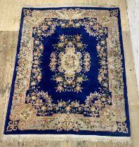 A Chinese super washed wool carpet, the blue field characteristically decorated 244cm x 330cm