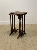 A 19th century mahogany nest of two tables, the moulded tops raised on ring turned supports with