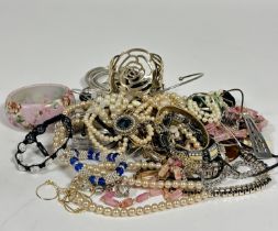 A collection of costume jewellery including paste pearl necklaces, gilt bracelet, gilt chains