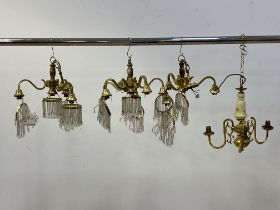 A pair of cast gilt brass three branch chandeliers with lustre drops, together with a matching