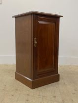 An Edwardian walnut bedside cupboard, the panelled door enclosing a shelf to interior H72cm,