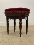 A Victorian rosewood rise and fall music stool, the top upholstered in red velvet, raised on