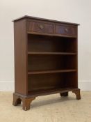 A Georgian style mahogany open bookcase, fitted with two drawers above two adjustable shelves,