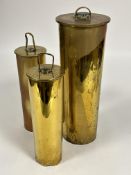 A WWI large brass shell case, ( D to top 15cm x L 42cm) and a 1915 and 1916 pair of brass shell