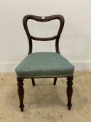 A mid 19th century mahogany side chair, the shaped back above an ample upholstered seat, raised on