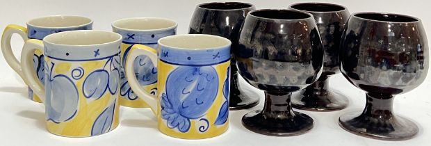 A set of four Whittard of Chelsea mugs decorated in yellow and blue with design of various fruits (