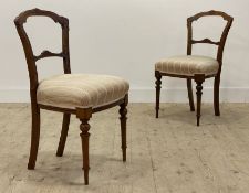 A pair of Victorian walnut side chairs in the Aesthetic taste, the show frame with floral incised
