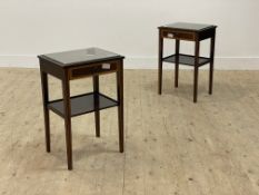 A pair of Georgian style inlaid mahogany side tables, with plate glass top above frieze drawer,