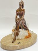 An Ebano International bronzed resin Vidal series sculpture of a female seated figure on crystal,