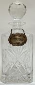 A cut crystal glass decanter of squared form with hallmarked silver baroque style whisky decanter