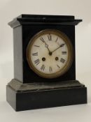 A Victorian slate mantel clock, the case, of rectangular form, enclosing a white enamel dial with