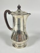 A Sheffield silver waisted hot chocolate pot the hinged cover with brown Bakelite knop and handle to