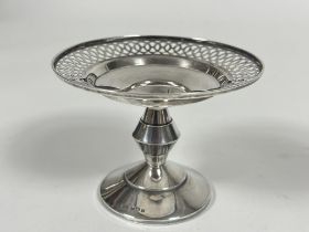 A Birmingham silver Art Deco style bon bon dish with pierced rim and stepped circular column on