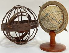 A wrought/cast iron gimbal sphere (h- 16cm), together with a vintage desk globe with paper cartogra