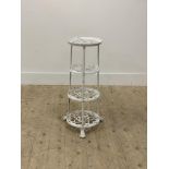 A white painted cast metal pan stand in the 19th century style, four graduated tiers raised on