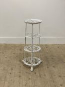 A white painted cast metal pan stand in the 19th century style, four graduated tiers raised on
